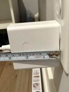 A photo of the Cozyla+2 wall plug showing it is 3 x 3 inches.